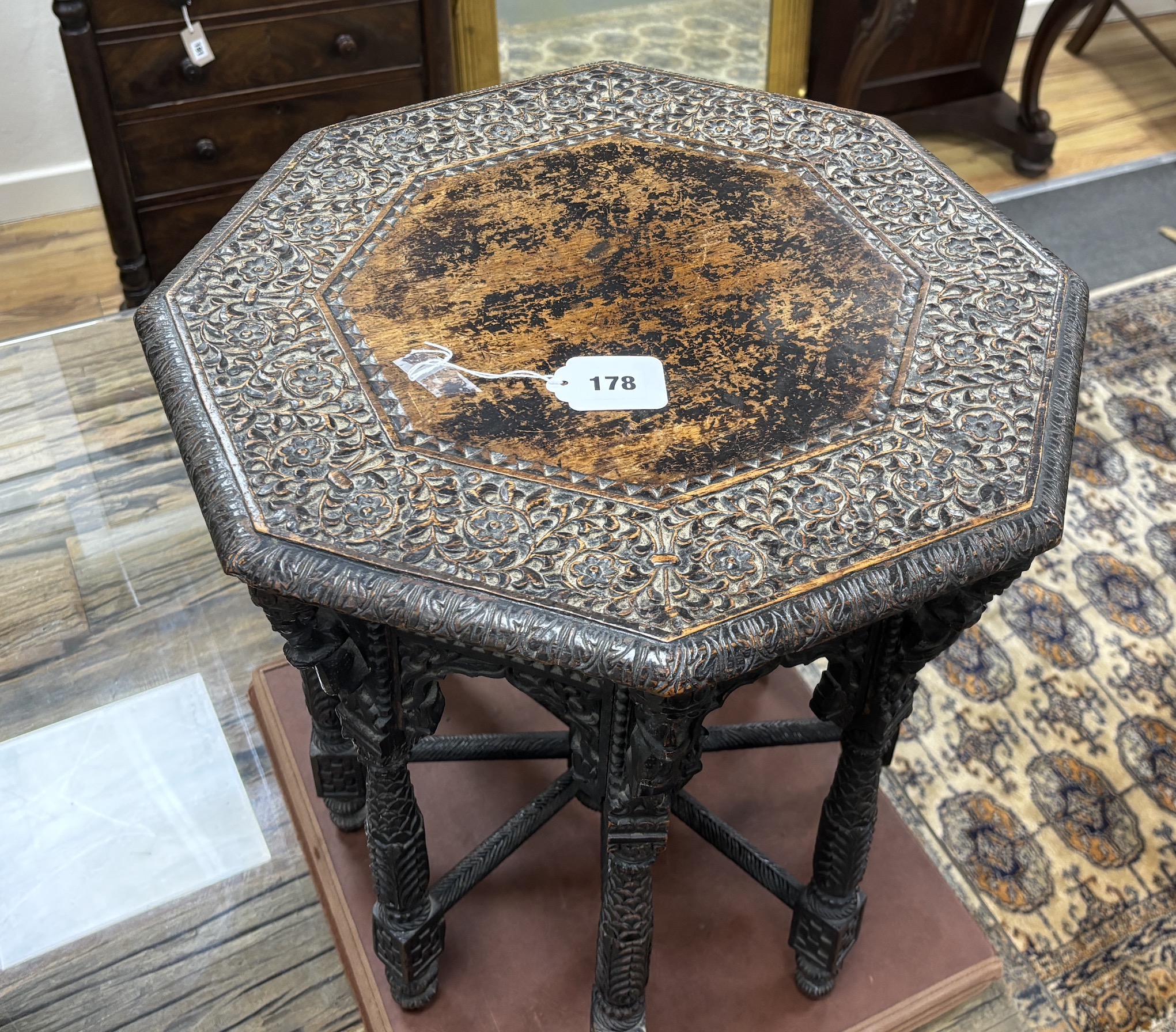 An Asian carved hardwood octagonal occasional table, width 49cm, height 49cm